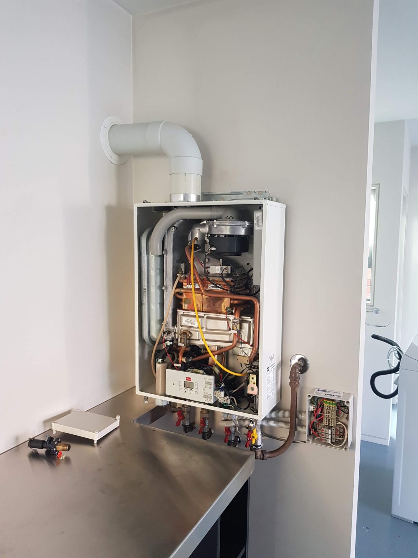 Continuous flow heater strip-down